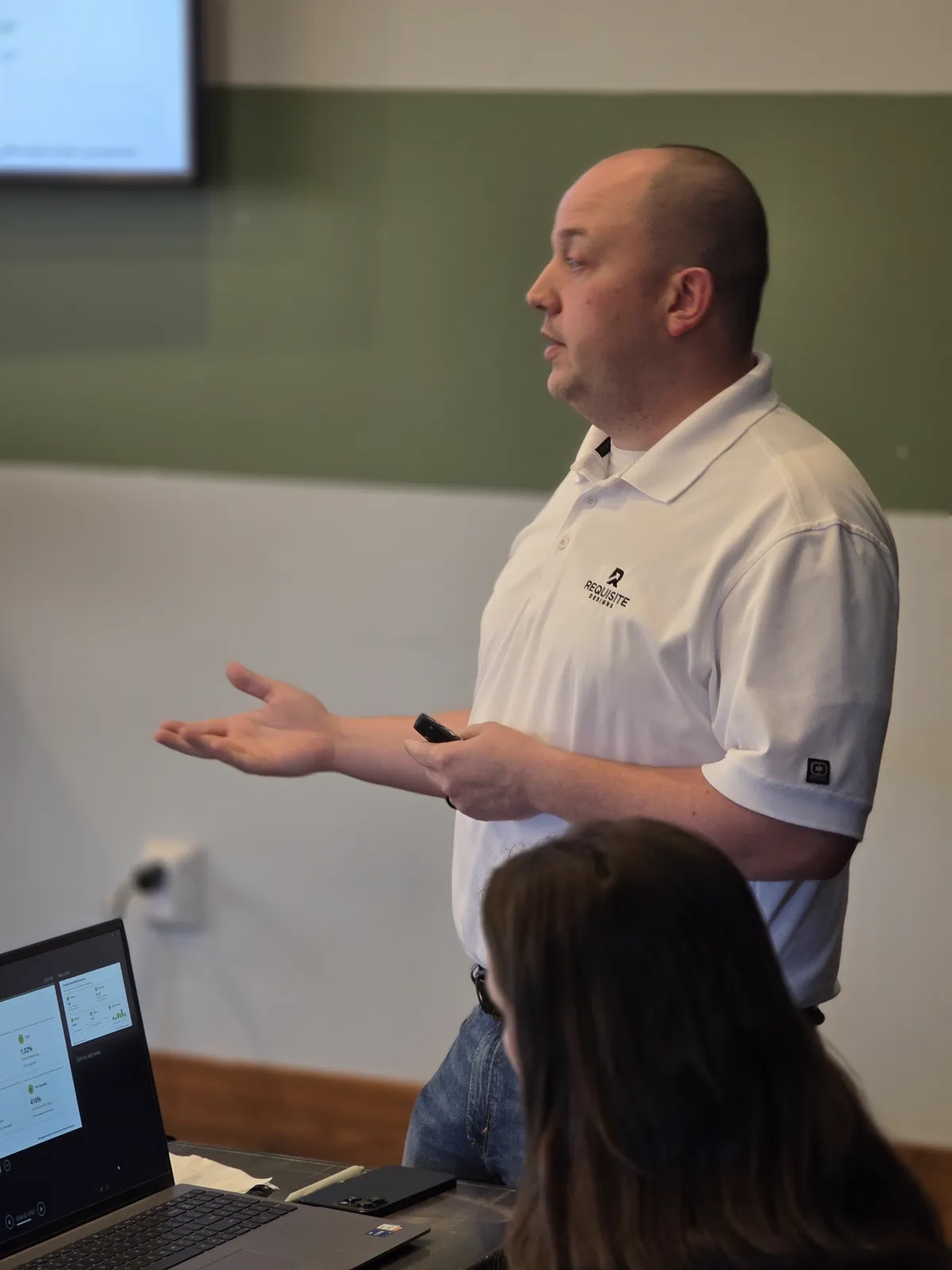 Cody Landry walking attendees through live dashboards